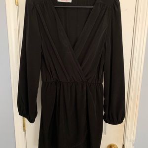 Black above the knee dress. Low cut v neck.